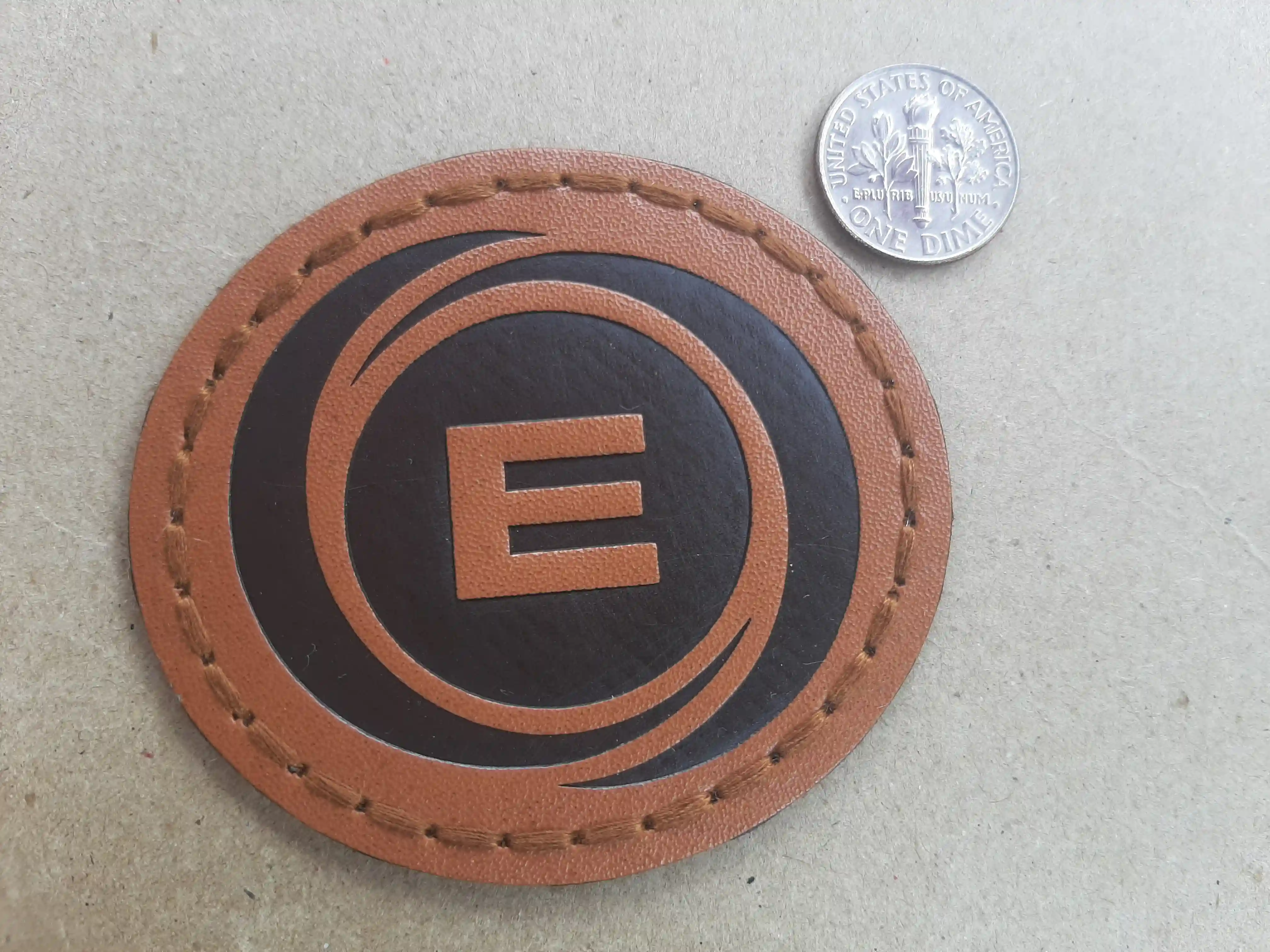 2 Tone Faux leather with die-cut patch creating precise edges and perfection for high end promotional merch and corporate branding.  Stylish. Custom. Faux Leather. For Your Name Drops Stylish E